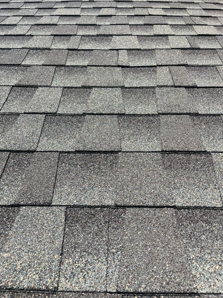 Worn gray architectural shingles on a home in Ambler, PA before replacement