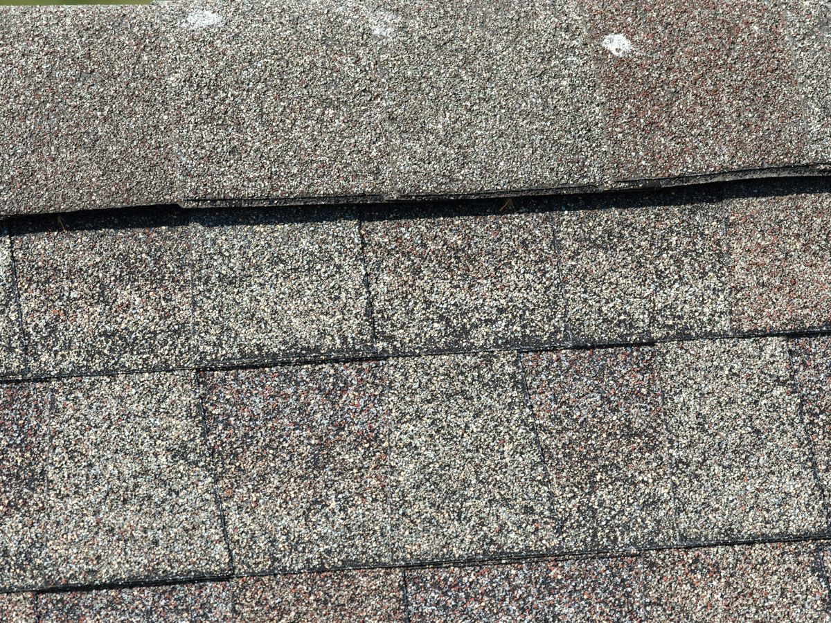 Close-up of worn, cracking shingles on a home in Dresher, PA
