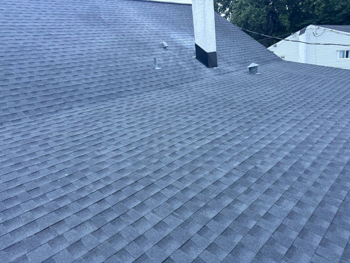 New charcoal GAF shingle roof with a chimney in Horsham, PA