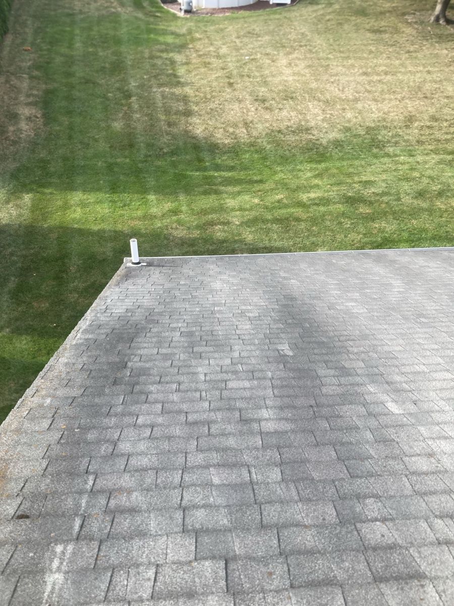 Worn, stained old shingle roof on a ranch home in Hatboro, PA