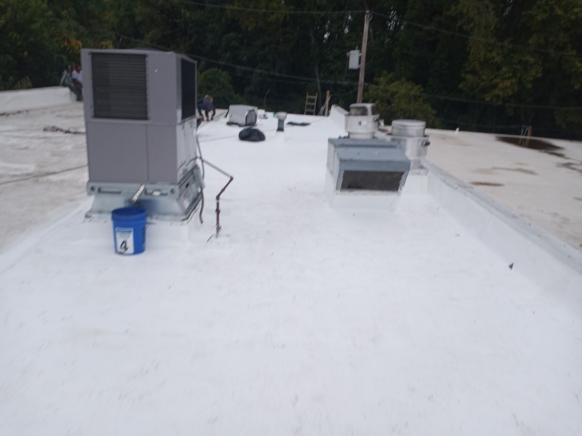 Clean white TPO flat roof with rooftop HVAC units in Fairless Hills, PA