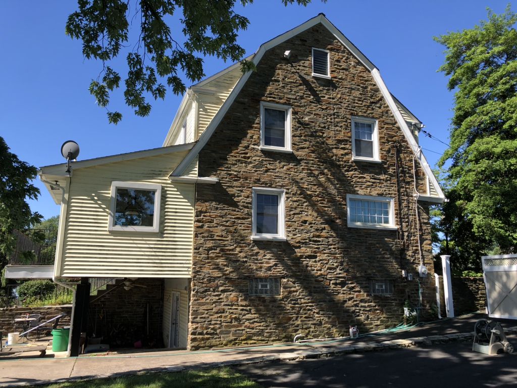 Stone home with a gambrel roof on Radcliffe Street in Bristol, PA