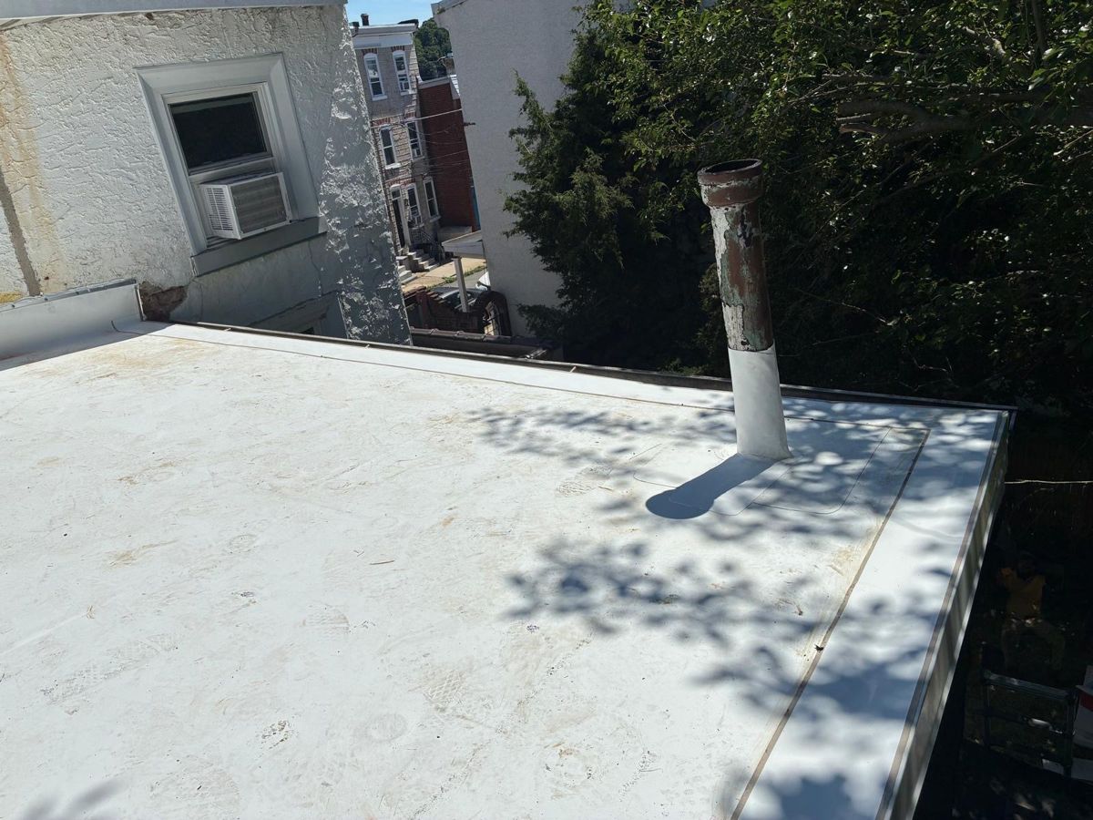 New white TPO flat roof on a Manayunk rowhome