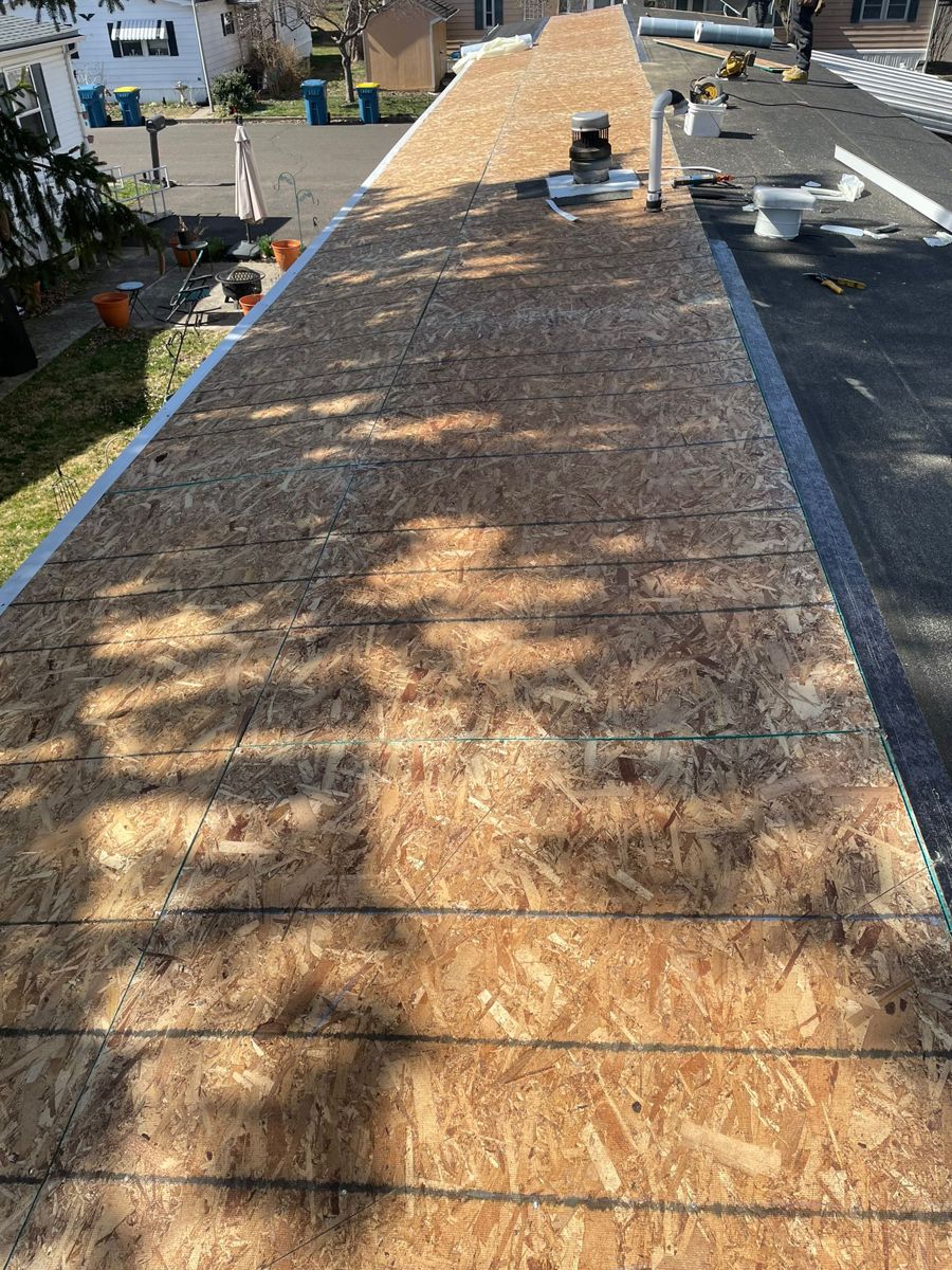 New OSB roof decking laid the length of a manufactured home in Morrisville