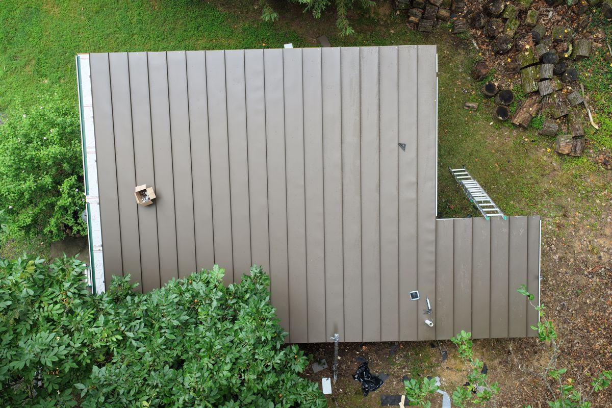 New standing-seam metal roof on a guest house in New Hope, seen from above