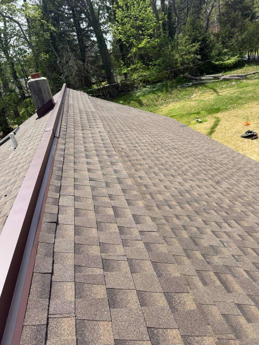 New architectural shingles running along the ridge of a New Hope roof