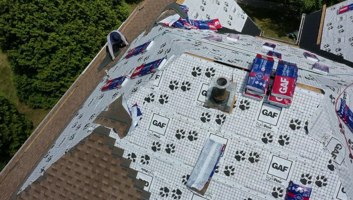 GAF Tiger Paw underlayment and bundles of GAF Timberline HDZ shingles on a Southampton roof during tear-off