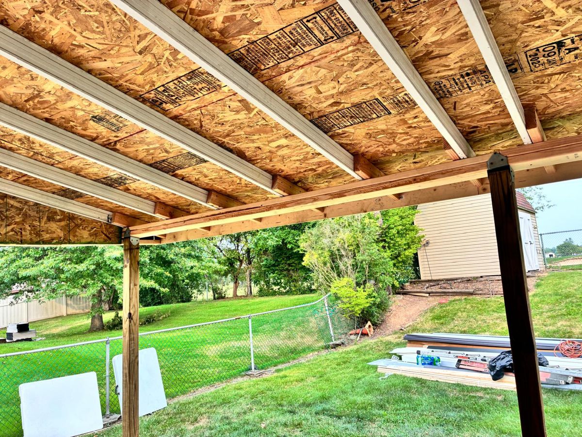 Patio cover framing and new roof sheathing during a rebuild in Warminster