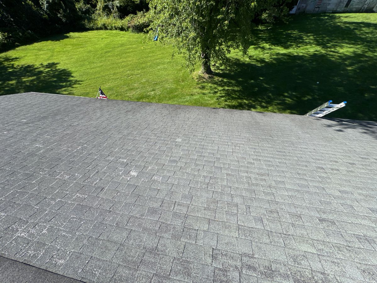Worn gray three-tab shingle roof on a ranch home in Jamison, PA