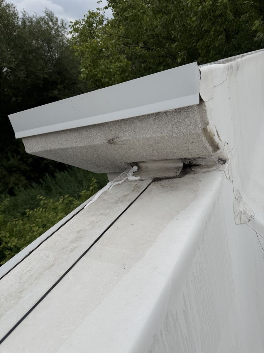 Resealed metal coping and TPO membrane on a commercial flat roof in Warrington, PA