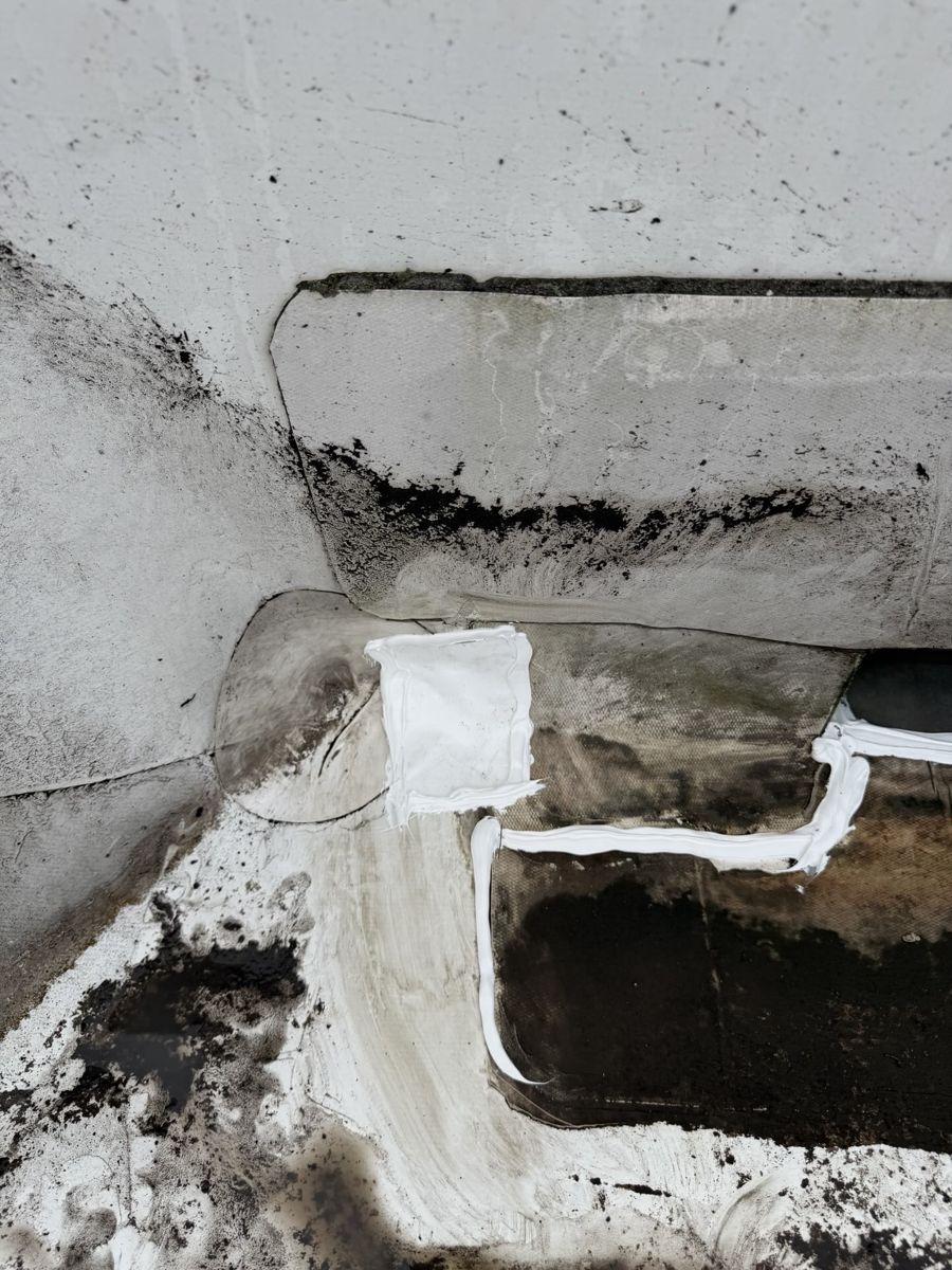 New TPO patch and sealant where a flat roof meets a stucco wall in Warrington, PA