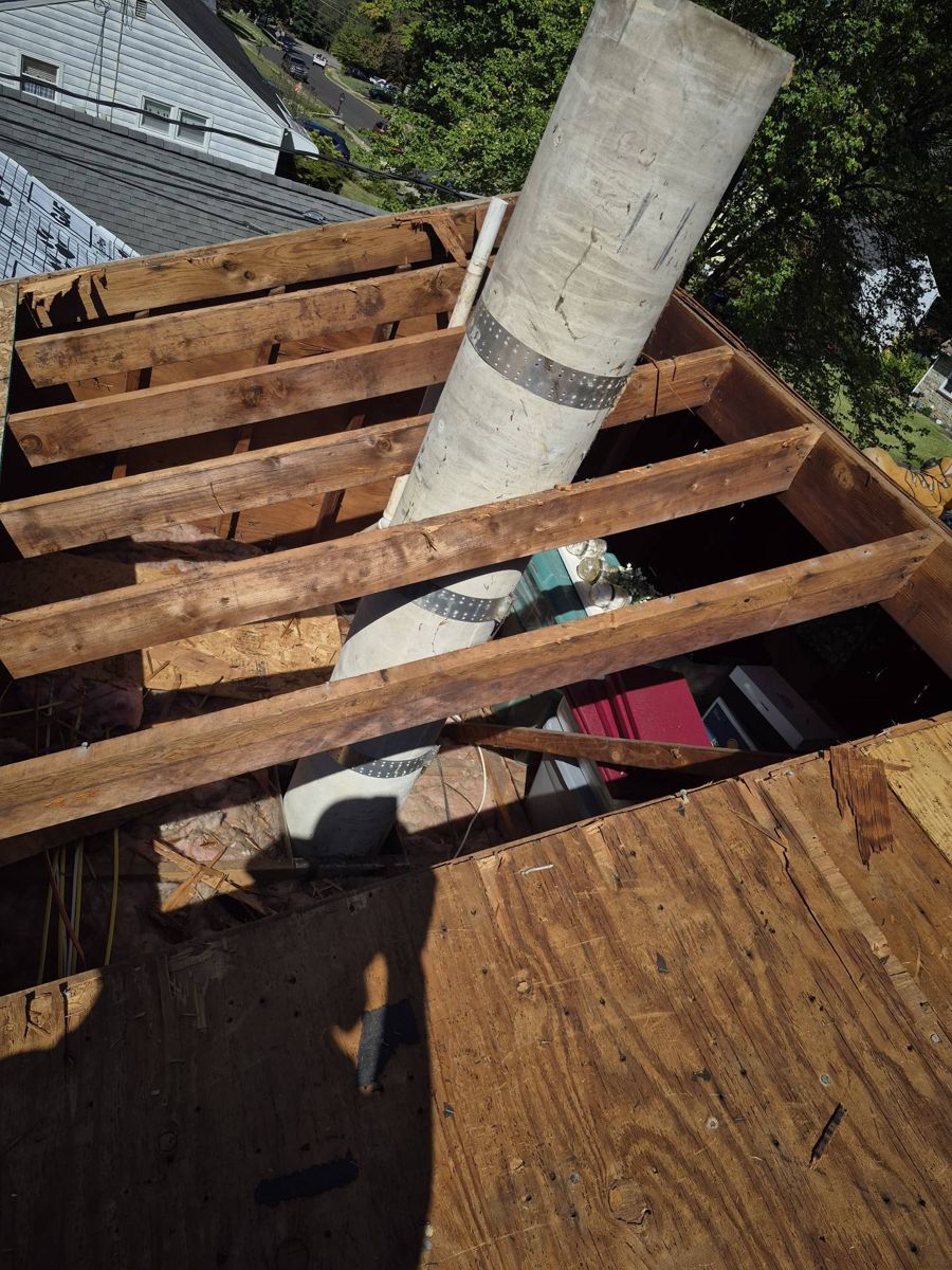 Roof opened down to the rafters with new plywood decking going in on a Willow Grove, PA home